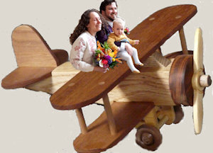 toy plane with Joy, Lawrence, Kairos riding it