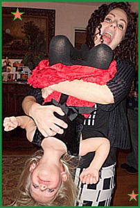 Beatrice holding Helen upside down