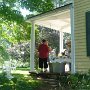 Hope and Lizzie chat on Front porch