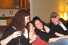 the kids on a sofa, all laughing